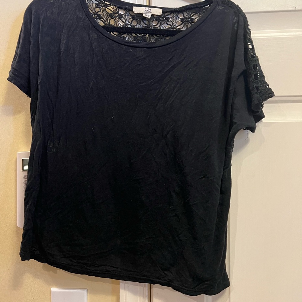 Black YA LA shirt.Black shirt in front. sheer with pattern on back